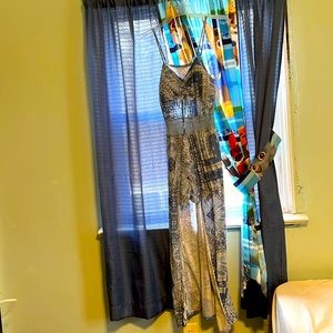 Beautiful blue spring/summer dress so but has a smaller fit.